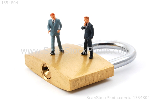 Image of business man on security padlock 