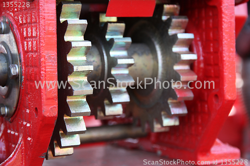 Image of A large chain drive on a seed separator machine.