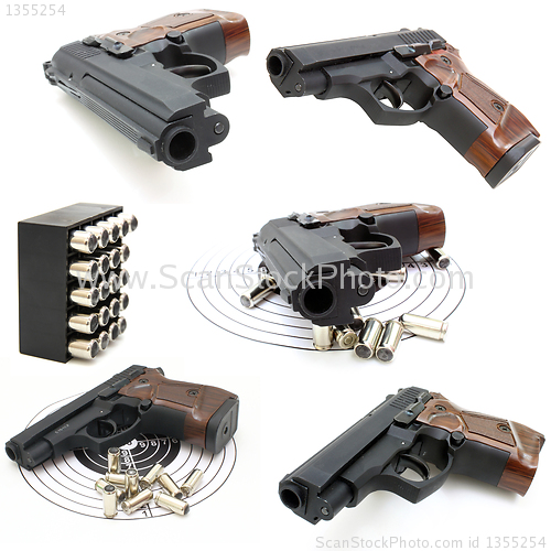 Image of Set of The close up of a pistol a target and cartridges is isola