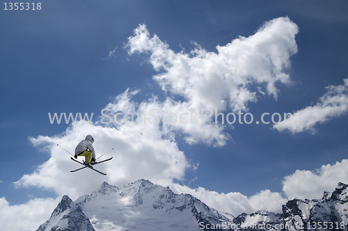 Image of Freestyle ski jumper with crossed skis