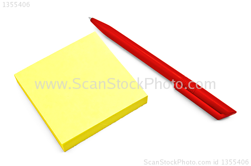 Image of Yellow paper with a red pen