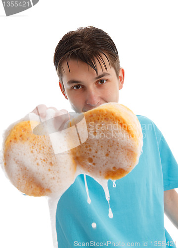 Image of Child with soapy dripping sponge