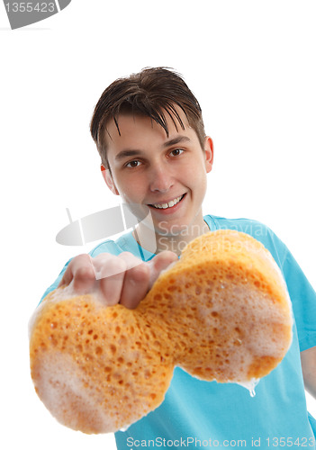 Image of Boy using a soapy sponge to clean