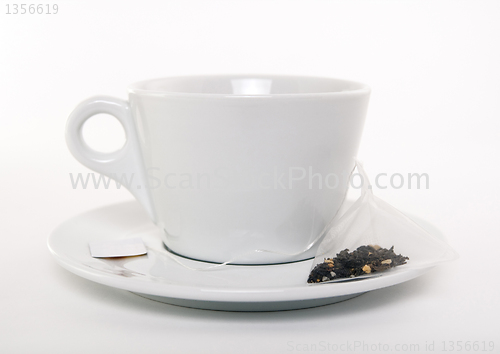 Image of White cup of tea and teabag