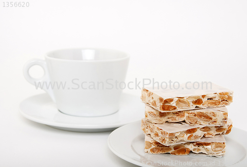 Image of Turron, traditional Spanish dessert and a teacup