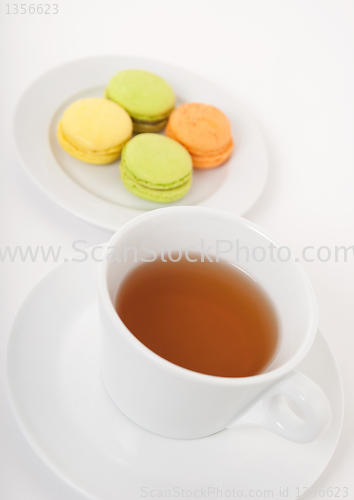Image of Cup of tea and macarons for dessert