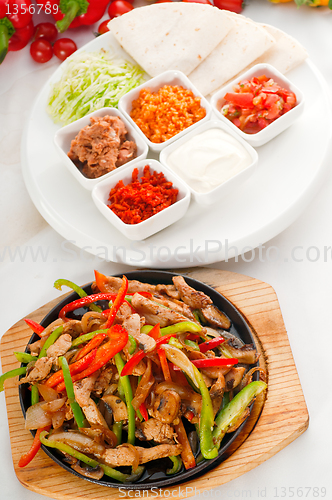 Image of original fajita sizzling hot  on iron plate