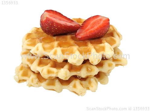 Image of waffles with strawberries and honey