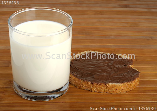 Image of milk and a sandwich with peanut butter