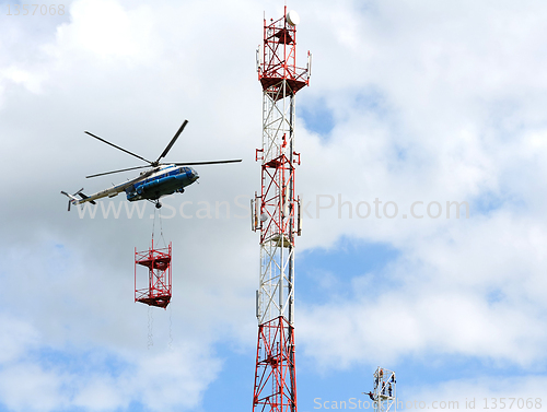 Image of installation of cell tower by helicopter