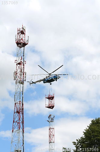 Image of installation of cell tower by helicopter