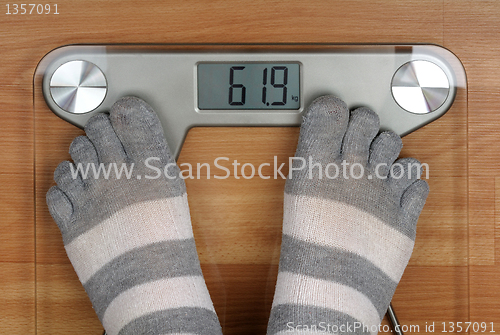 Image of feet on the scales