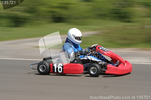 Image of Speeding red go-kart