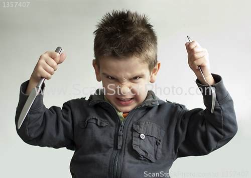 Image of Child with a knife and fork