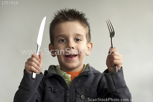 Image of Child with a knife and fork
