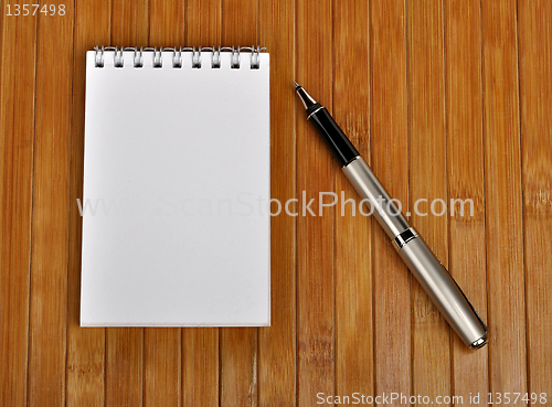 Image of pen and notebook