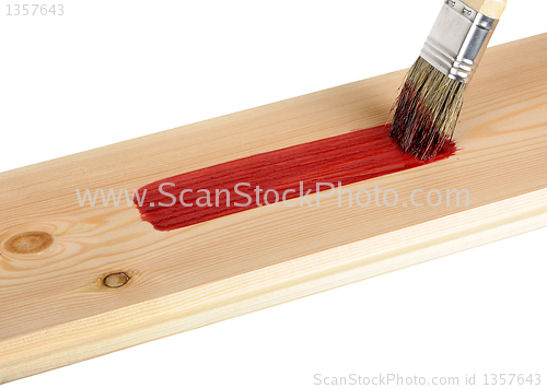 Image of painted wooden board with red paint