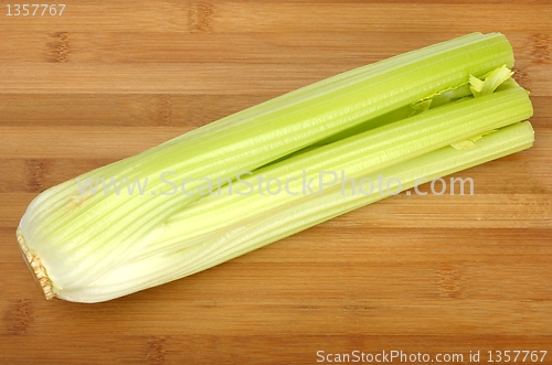 Image of celery on a wooden board