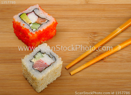 Image of sushi on wooden background