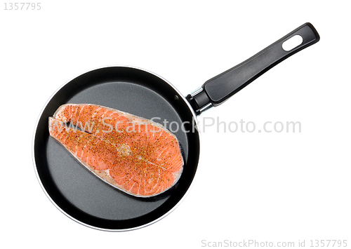 Image of salmon steak in a frying pan