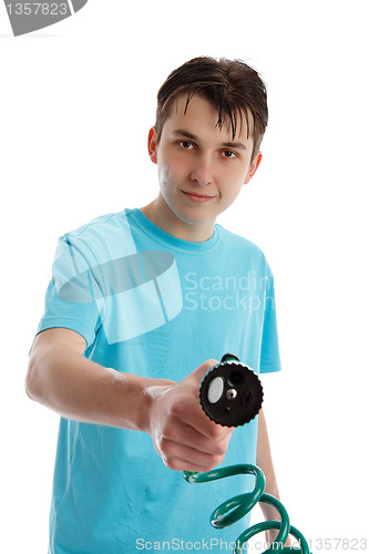 Image of Smiling boy holding garden hose