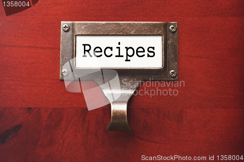 Image of Lustrous Wooden Cabinet with Recipes File Label