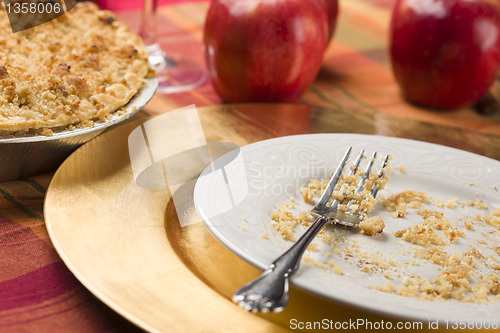 Image of Apple Pie and Empty Plate with Remaining Crumbs