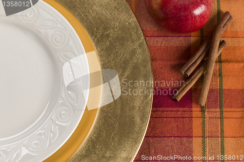 Image of Abstract Table Setting of Apple and Cinnamon with Plate