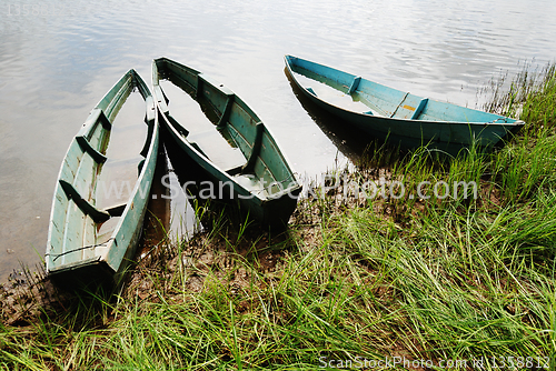 Image of three wooden boats