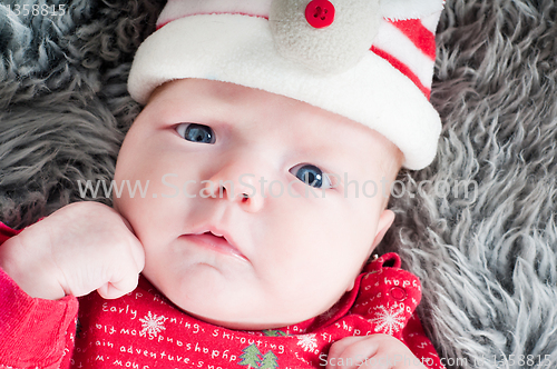 Image of Little cute baby in red