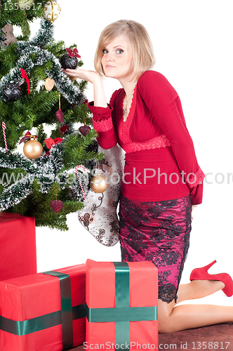 Image of Happy woman with Christmas presents