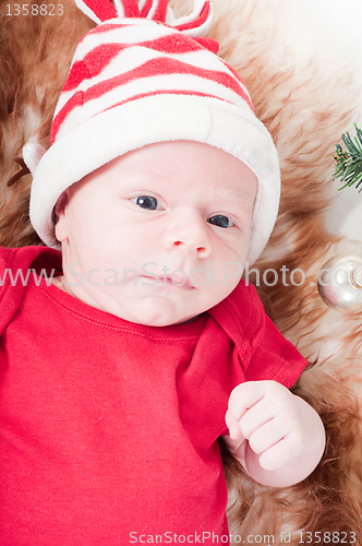 Image of Newborn baby in chritstmas hat