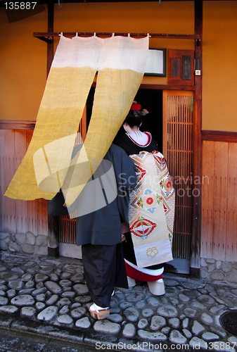 Image of Geisha entering in a tea house