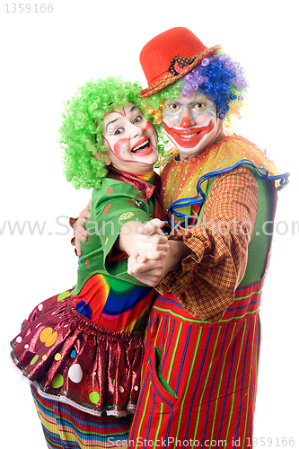 Image of A couple of smiling clowns dancing