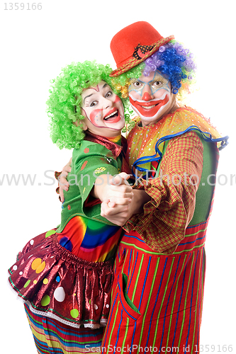 Image of A couple of smiling clowns dancing