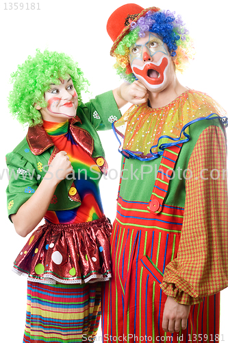 Image of Female clown punching clown