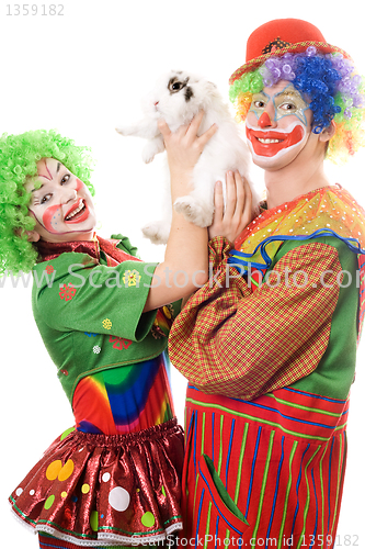 Image of Two playful clown with a white rabbit