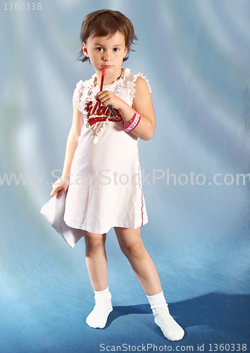 Image of little  school girl  thinking on blue background