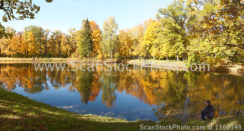 Image of Teen Enjoys the Fall Alone near water