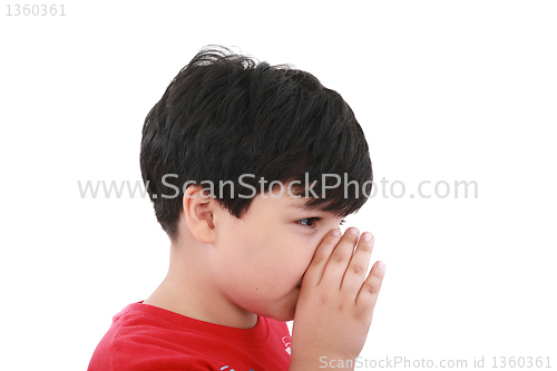 Image of a boy is telling a secret with a hand symbol