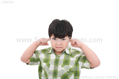 Image of Photo of a boy with his fingers in his ears. 