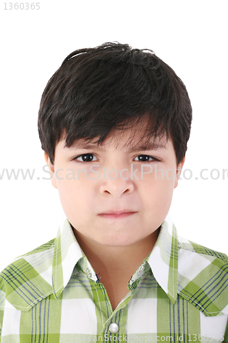 Image of Portrait of beautiful little boy with serious look isolated on w