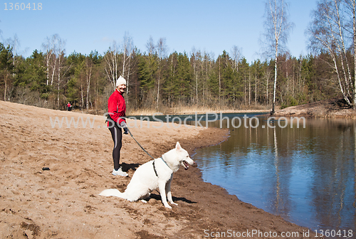 Image of  sports woman with a dog