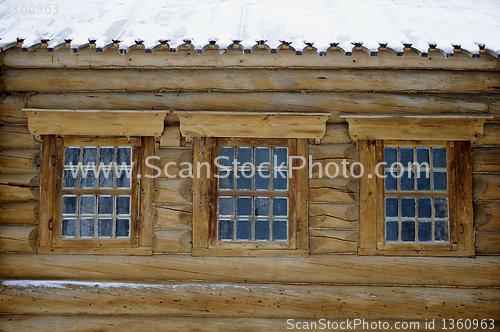 Image of three windows in an old house