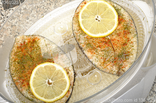 Image of steak fish in food steamer