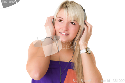 Image of Young beautiful girl listening to musik