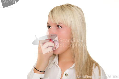 Image of Young girl eating an apple