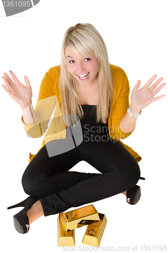 Image of Young happy girl with goldbars