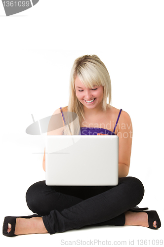 Image of Young smiling girl with laptop