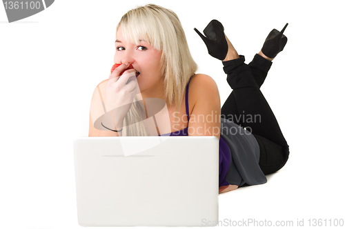 Image of Young girl eating an apple